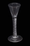 Mid-18th century tall mercury twist wine or cordial glass, the drawn trumpet bowl above plain