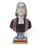 Wood type figure of John Wesley on a rectangular base decorated in polychrome, 25cm high