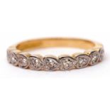18ct gold diamond half eternity ring featuring nine small diamonds, each in heart shaped engraved