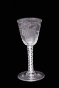Mid-18th century wine glass, the large rounded funnel bowl above a double series opaque twist