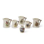 Set of five early 20th century Royal Worcester jugs all painted with birds by William Powell, the