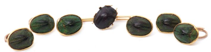Mixed Lot: six antique scarab beetle buttons, the iridescent scarabs set in mid-grade yellow metal