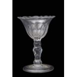 18th century sweetmeat glass with an ogee bowl above a faceted stem and polished foot, 12cm high