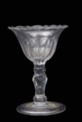 18th century sweetmeat glass with an ogee bowl above a faceted stem and polished foot, 12cm high