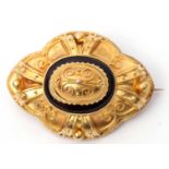 Victorian yellow gold and onyx target brooch, circa 1880, centred with a filigree decorated dome and