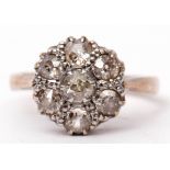 Diamond cluster ring featuring seven old cut diamonds, the principal diamond 0.15ct approx, in a