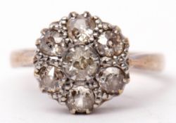 Diamond cluster ring featuring seven old cut diamonds, the principal diamond 0.15ct approx, in a