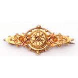 Early 20th century 15ct gold Etruscan brooch, typically decorated with scrolls, beads and rope twist