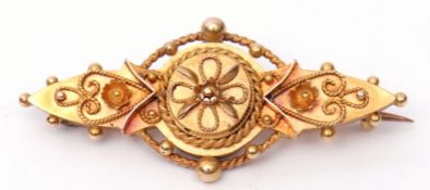Early 20th century 15ct gold Etruscan brooch, typically decorated with scrolls, beads and rope twist