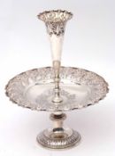 Edward VII pedestal epergne/fruit dish of circular form, the dish heavily embossed with scroll and