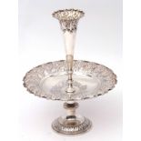 Edward VII pedestal epergne/fruit dish of circular form, the dish heavily embossed with scroll and