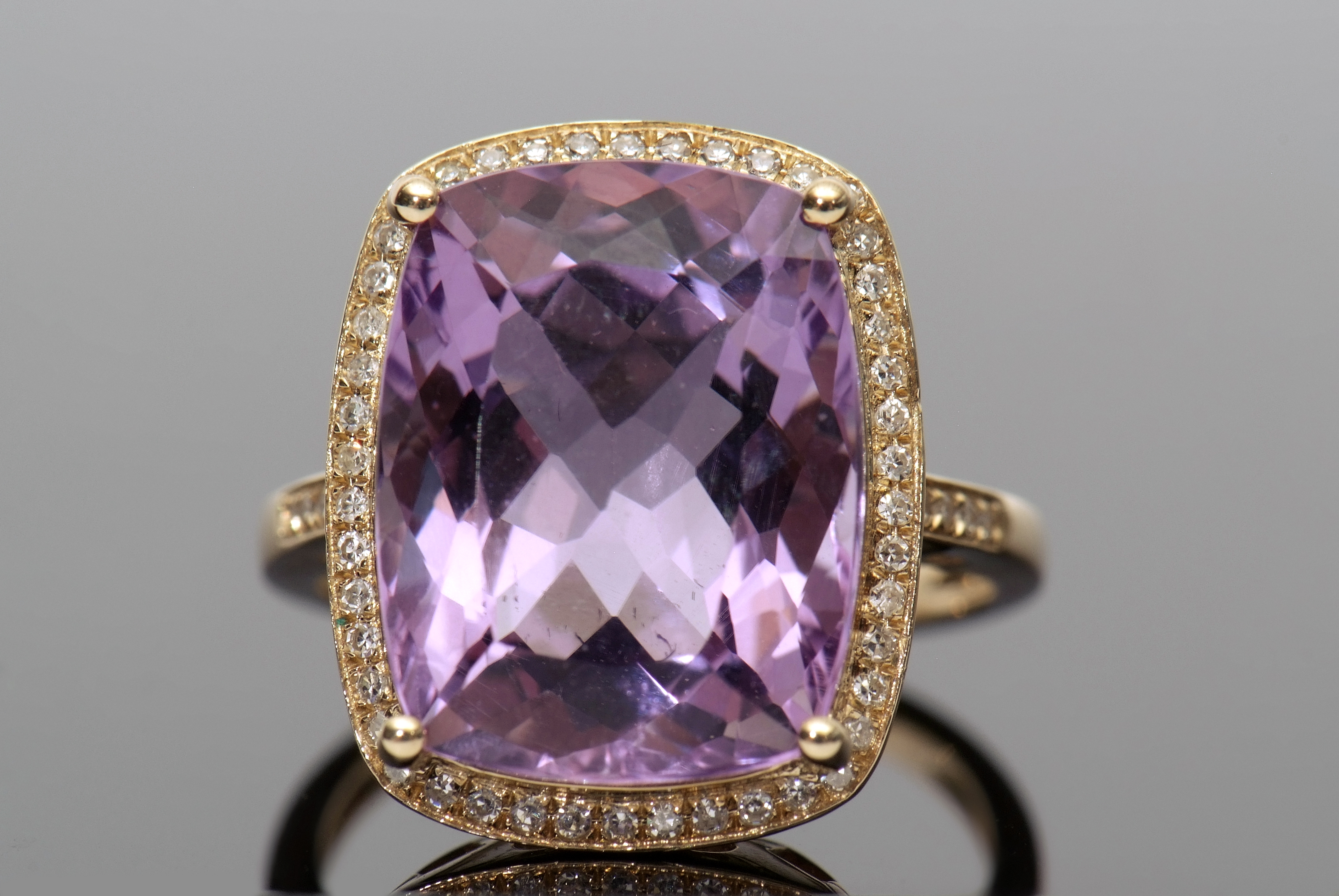 Amethyst and diamond ring, a cushion cut purple amethyst approx 9.40ct, set within a diamond