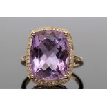 Amethyst and diamond ring, a cushion cut purple amethyst approx 9.40ct, set within a diamond