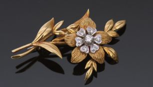 18ct gold and diamond floral spray brooch by Cropp & Farr, a polished and textured leaf design