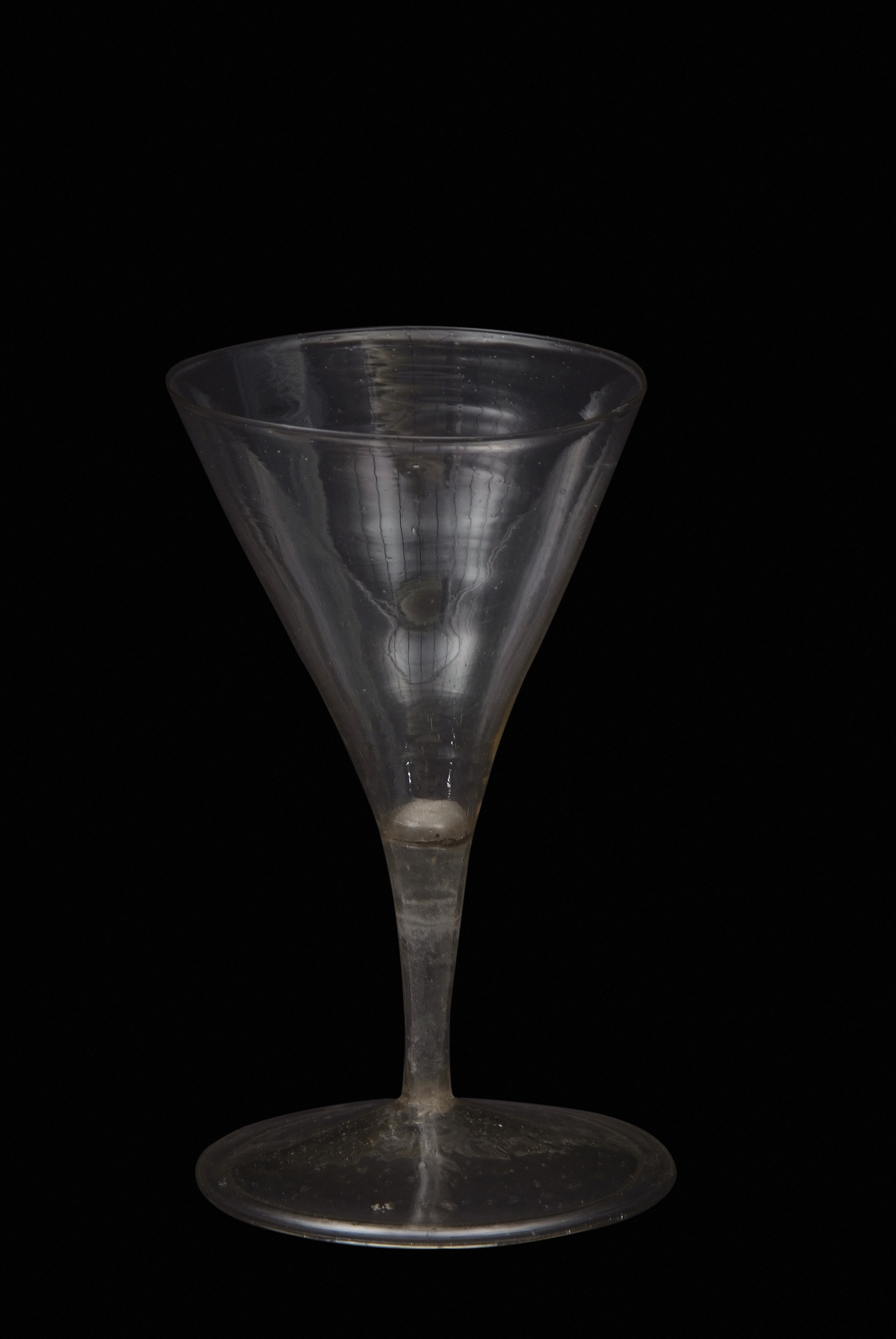 Mid-17th century facon de Venise soda glass, the trumpet bowl over short slender hollow stem with