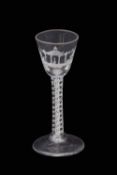 Mid-18th century double series opaque twist wine glass with four spiral tapes and a pair of 7-ply