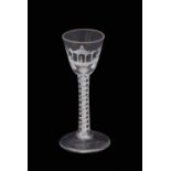 Mid-18th century double series opaque twist wine glass with four spiral tapes and a pair of 7-ply