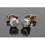 Pair of brilliant cut diamond stud earrings in coronet settings, total weight 0.50 approx