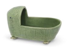 Staffordshire cream ware figure of a cradle with green glaze, circa 1800, 10cm long