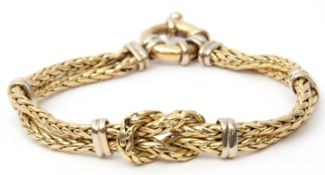 750 stamped bracelet, a two-strand woven design with central tied knot and five spacers to a bolt