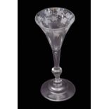 Mid-18th century light baluster wine glass with trumpet bowl engraved with fruiting vine above a