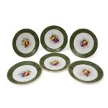 Group of six early 20th century Royal Worcester plates, the centres painted with fruit, signed by