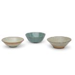 Group of three Chinese pottery bowls including a shaped Longquan celadon type bowl with crackle