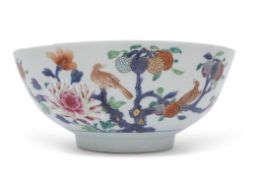 Early 18th century Chinese export punch bowl, decorated in enamels with a bird perched on branches