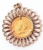 George V sovereign dated 1913, framed in a 9ct gold spiral pendant mount, 8.1g gross weight