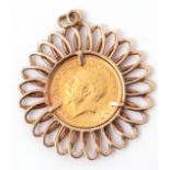 George V sovereign dated 1913, framed in a 9ct gold spiral pendant mount, 8.1g gross weight