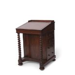19th century rosewood Davenport with brown tooled leather insert fitted with four drawers with
