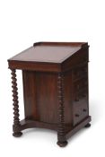 19th century rosewood Davenport with brown tooled leather insert fitted with four drawers with