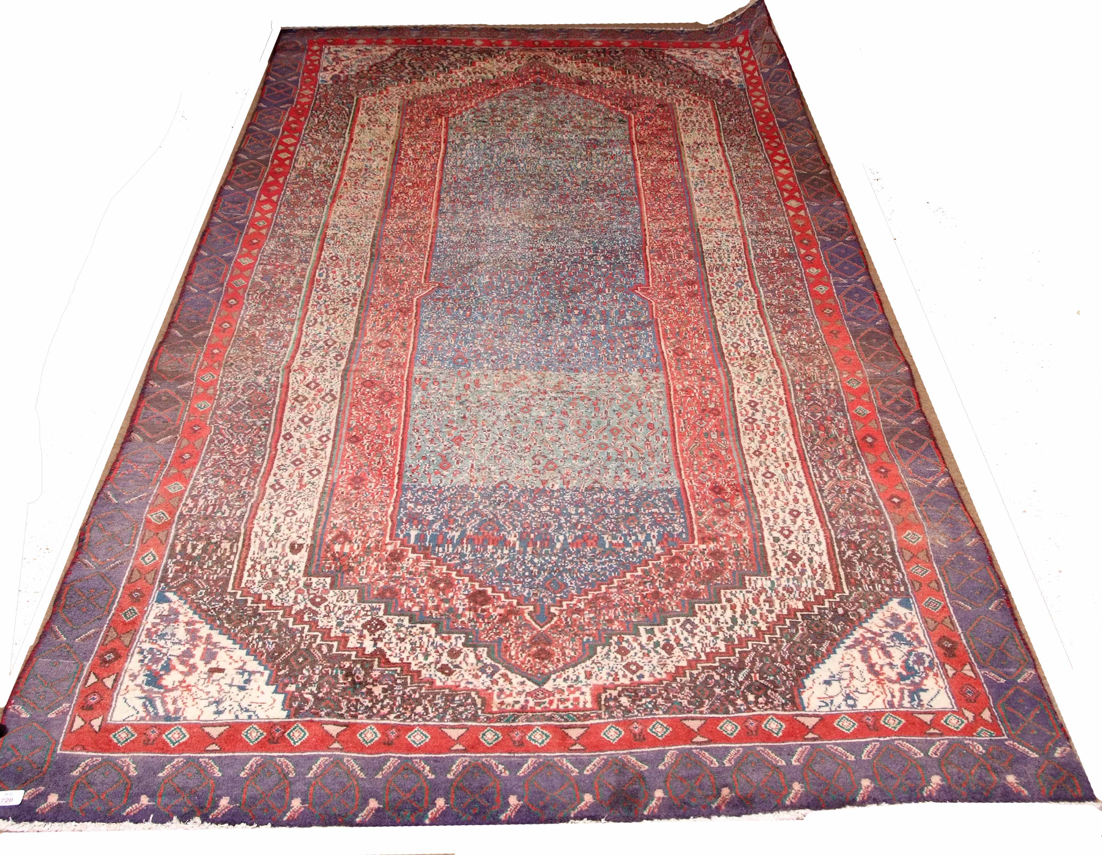 Modern Caucasian rug, multi-gull border and central geometric panels, mainly blue, red and beige