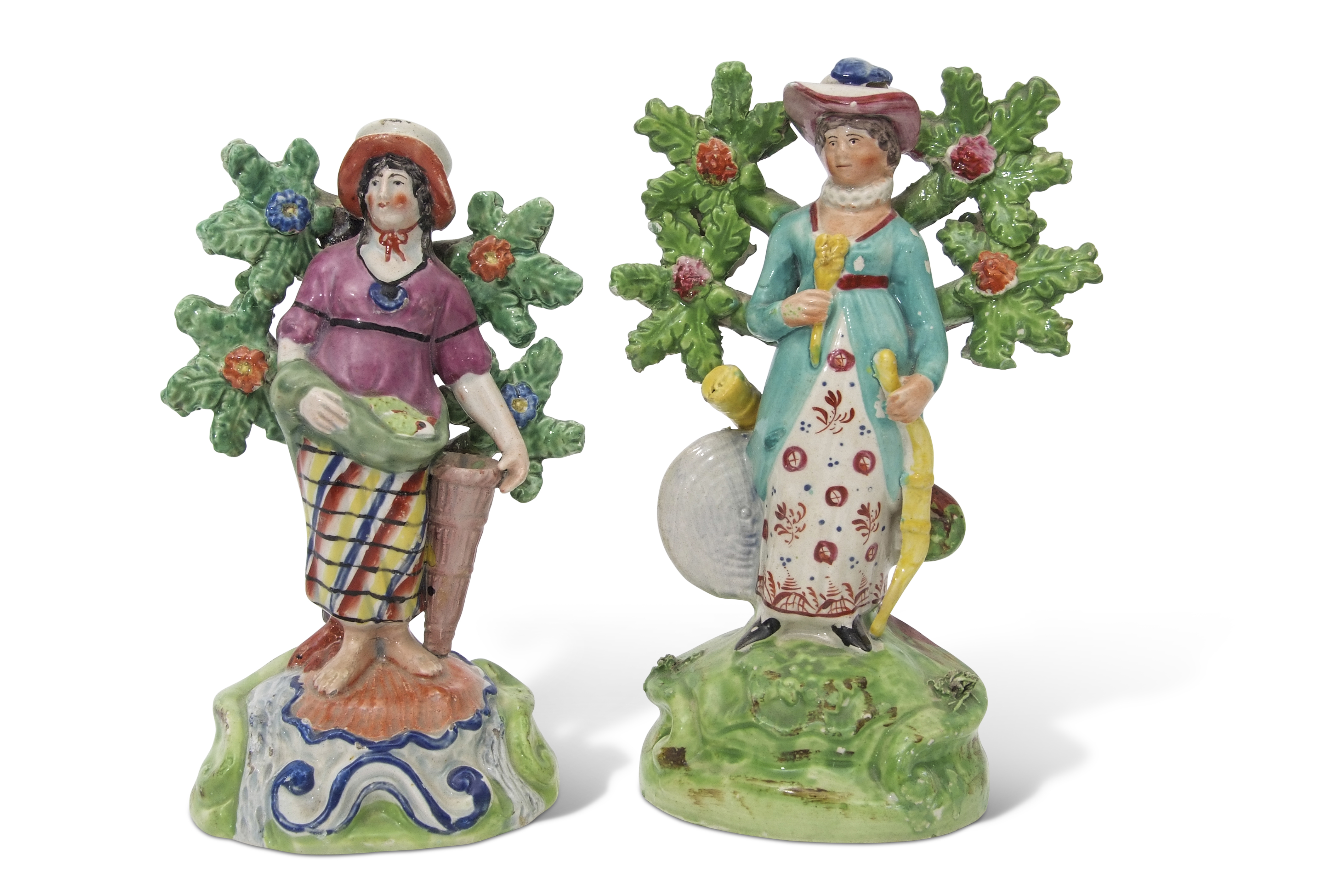Two Walton type Staffordshire figures, circa 1840, standing against bocage, one of a fish seller,