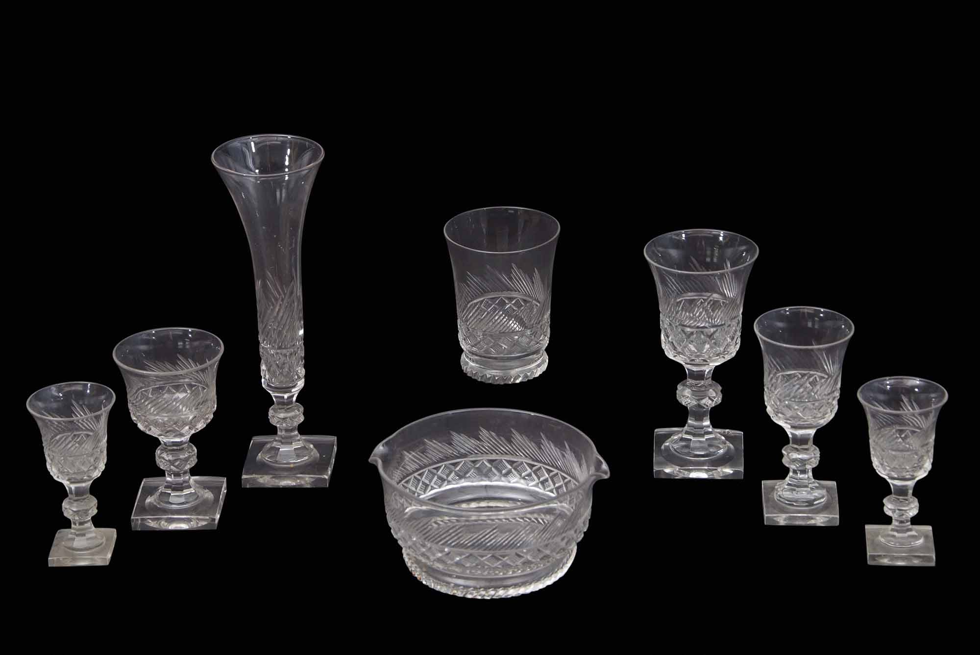 Extensive suite of mid 19th century cut glass wares including champagne flutes, wine glasses,