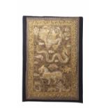 Burmese gold thread decorated wall hanging, the centre depicting a mythological scene of figure,