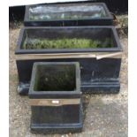 Pair of modern black painted garden planters of rectangular form on stepped bases, 74cm wide,