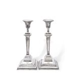 Large pair of late Victorian silver encased presentation candlesticks in neo-classical style, having