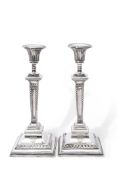 Large pair of late Victorian silver encased presentation candlesticks in neo-classical style, having