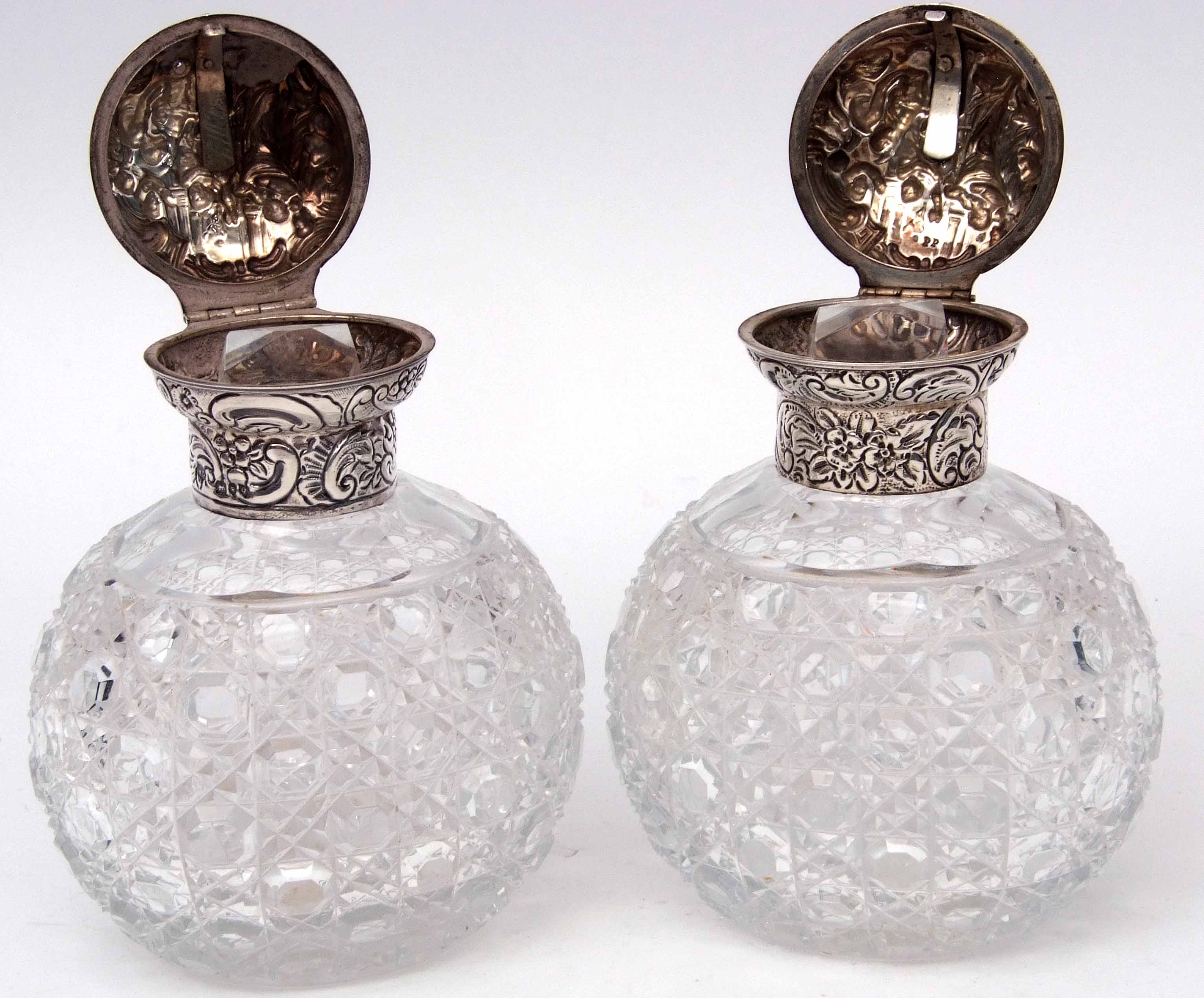 Pair of late Victorian hobnail cut oval glass scent bottles, the hinged lids and collars heavily - Image 4 of 5