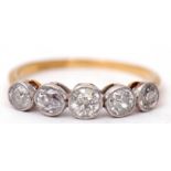 Five stone diamond ring featuring five old cut diamonds, each in millegrain settings and raised in a