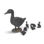 Good quality patinated free-standing bronze duck with six ducklings in varying poses (unsigned),