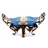 19th century Sevres style centrepiece, the porcelain bowl supported in a gilt scrolling frame, the