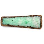 Antique Chinese carved jade brooch, the elongated shaped panel carved with a foliate and squirrel