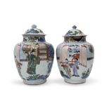 Pair of Chinese porcelain Wucai jars and associated covers, probably transitional period, the jars