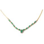 Emerald and diamond necklace set with eleven oval shaped Columbian emeralds, individually prong set,