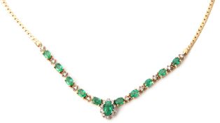 Emerald and diamond necklace set with eleven oval shaped Columbian emeralds, individually prong set,