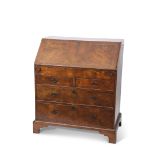 Early 18th century walnut cross banded bureau of two short over two full width drawers with brass