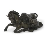 A patinated bronze group of a lion attacking a horse, 30cm wide x 18cm tall (max)