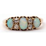 Late Victorian opal and diamond ring featuring three graduated oval cabochon opals highlighted